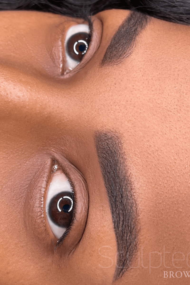 beautiful powder brows with perfect color done by Sculpted Studios Artist